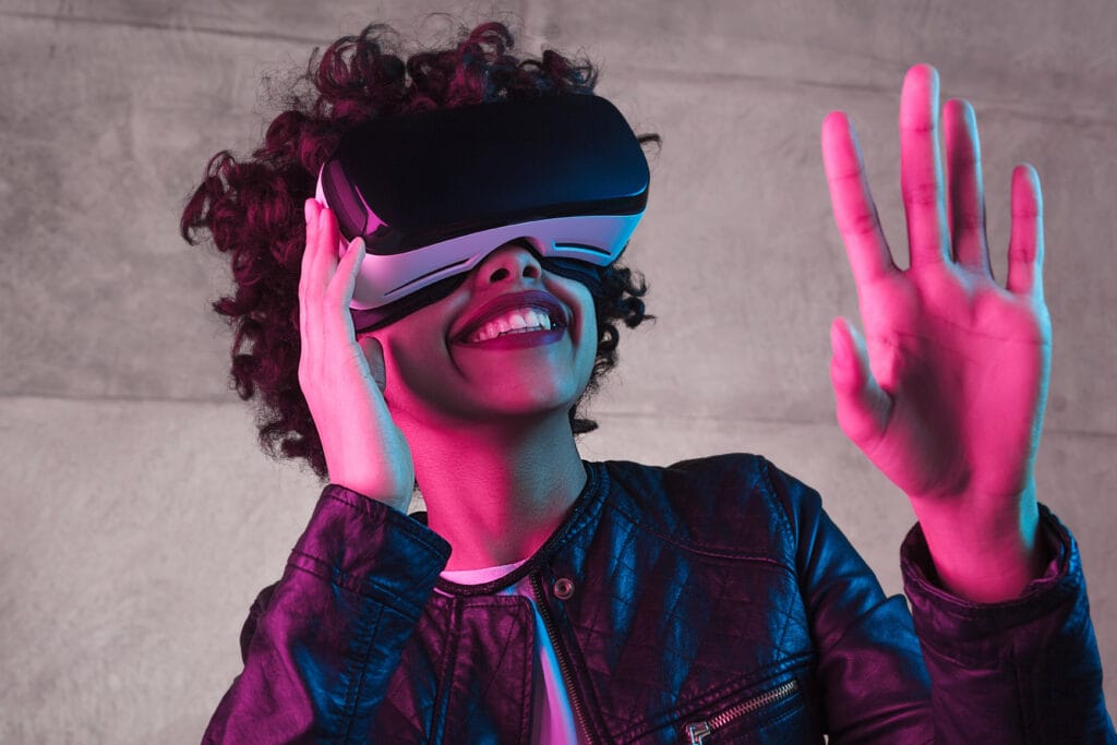 Smiling black teenager interacting with virtual reality